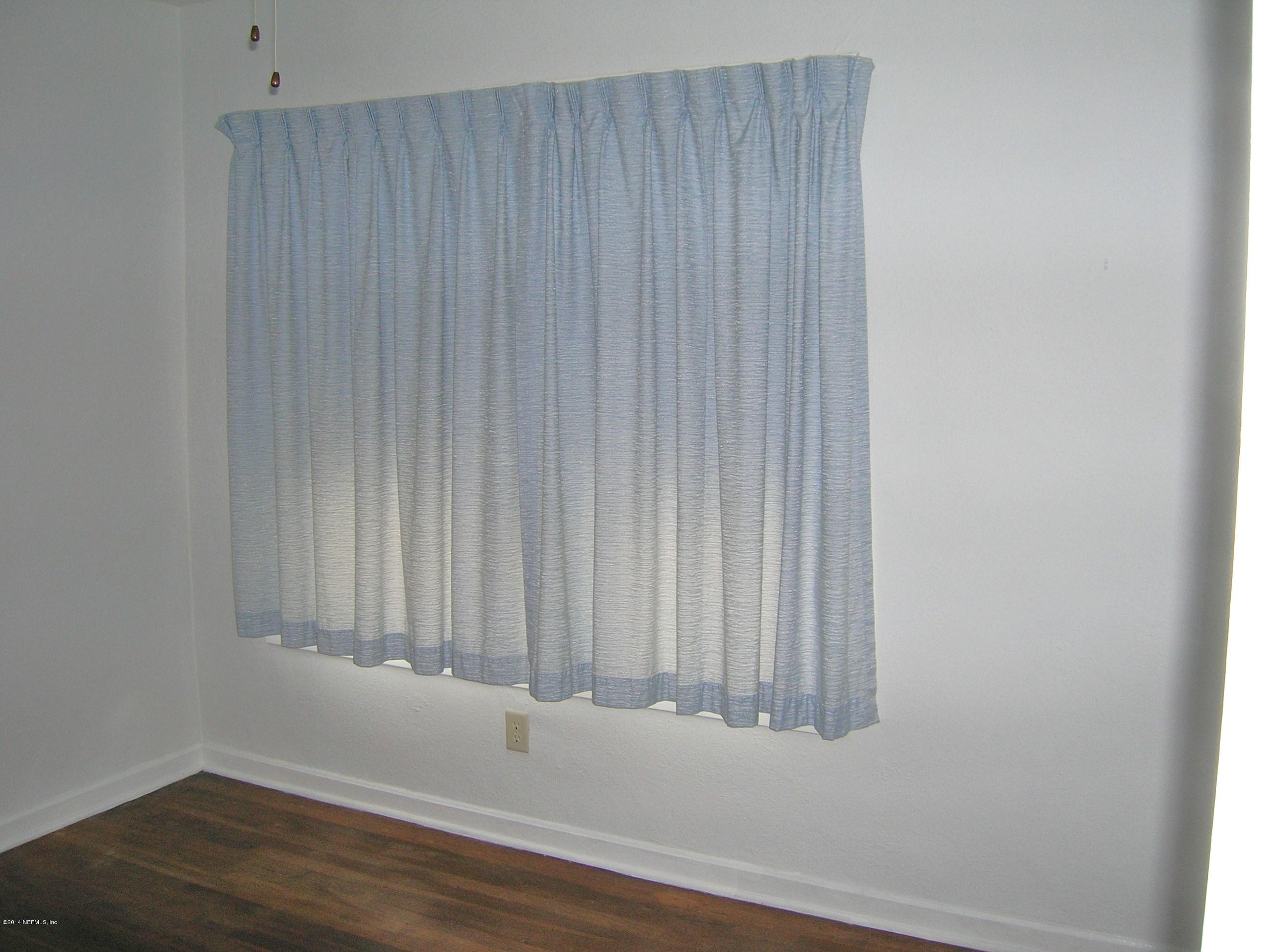 4648 Manchester Road Jacksonville, FL 32210 - Photo 13 of 16 a view of a small space with wooden floor