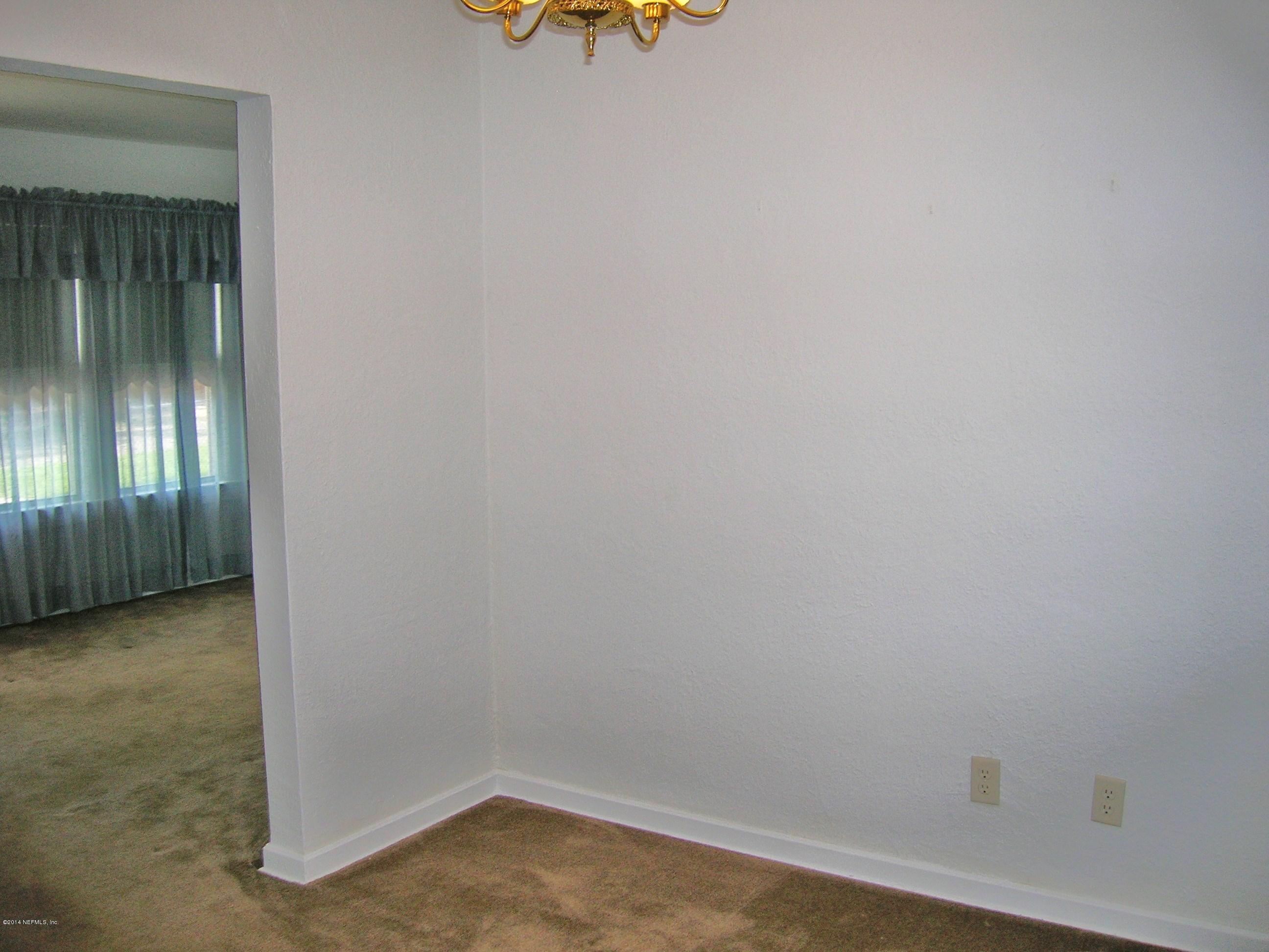 4648 Manchester Road Jacksonville, FL 32210 - Photo 7 of 16 wooden floor in an empty room