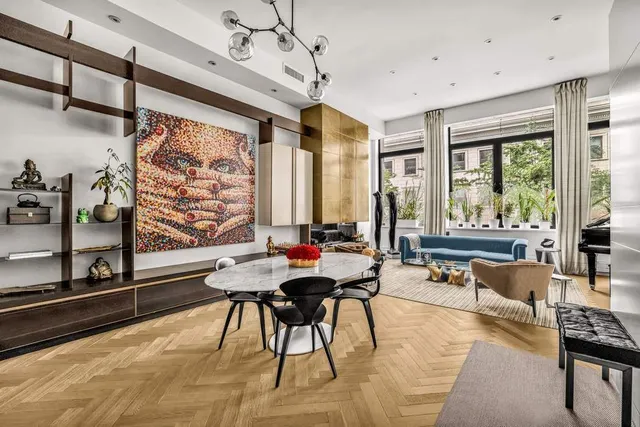 a living room with furniture and large windows