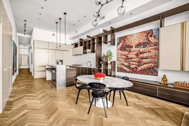 a kitchen with stainless steel appliances granite countertop a sink a stove and a refrigerator