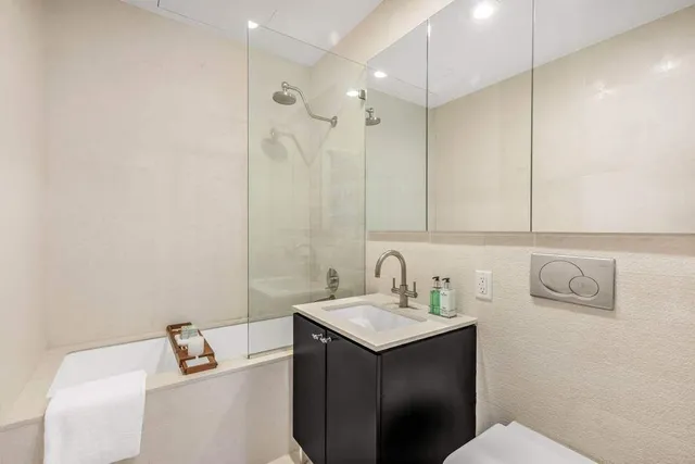 a bedroom with a bed and couch