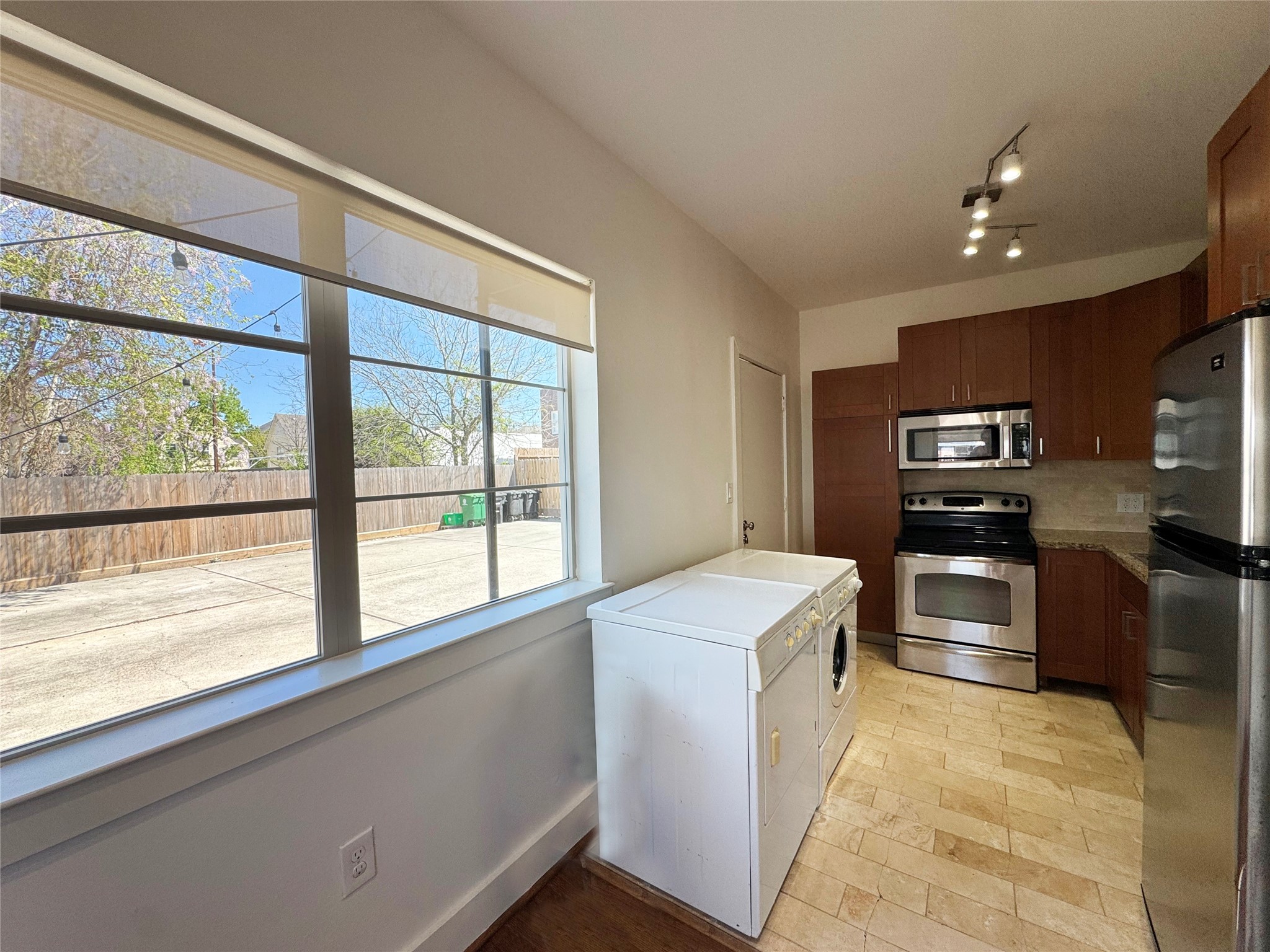 1509 Holman Street, Unit 2 Houston, TX 77004 - Photo 5 of 10 a kitchen with a stove a microwave and a sink
