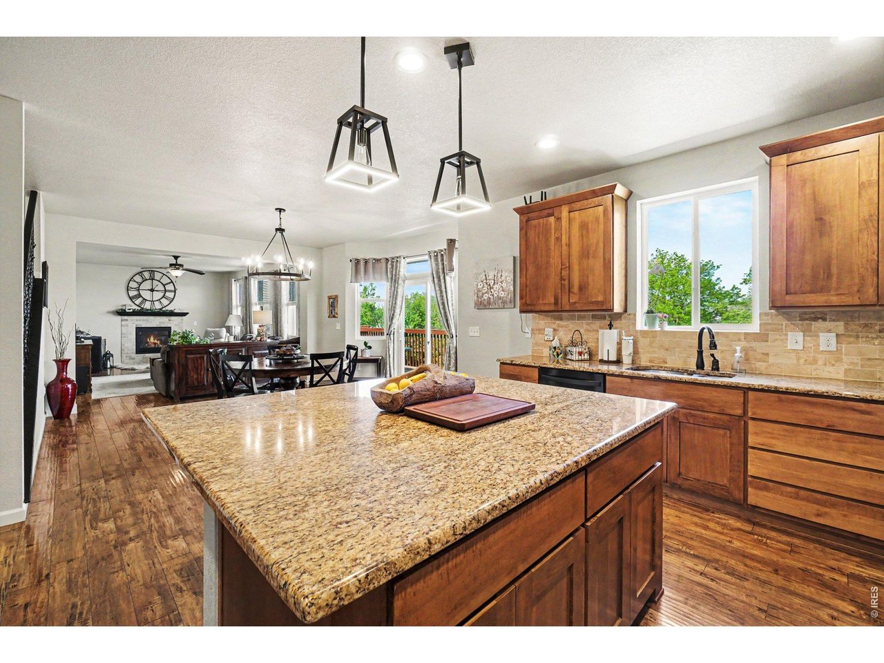1124 Wagon Bend Road Berthoud, CO 80513 - Photo 14 of 38 kitchen facing dining & living room and back deck door