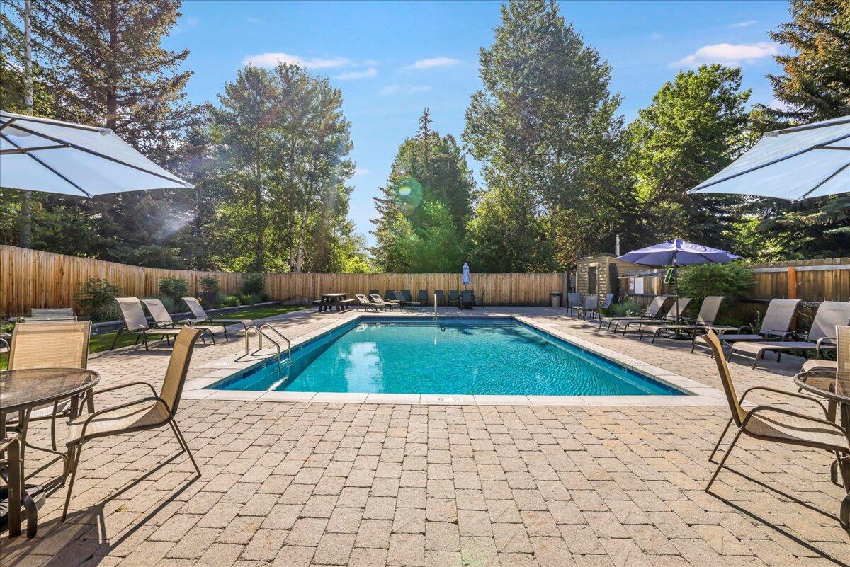 121 4 Seasons Way, Unit 13 Ketchum, ID 83340 - Photo 47 of 51 Pool, seating and umbrellas