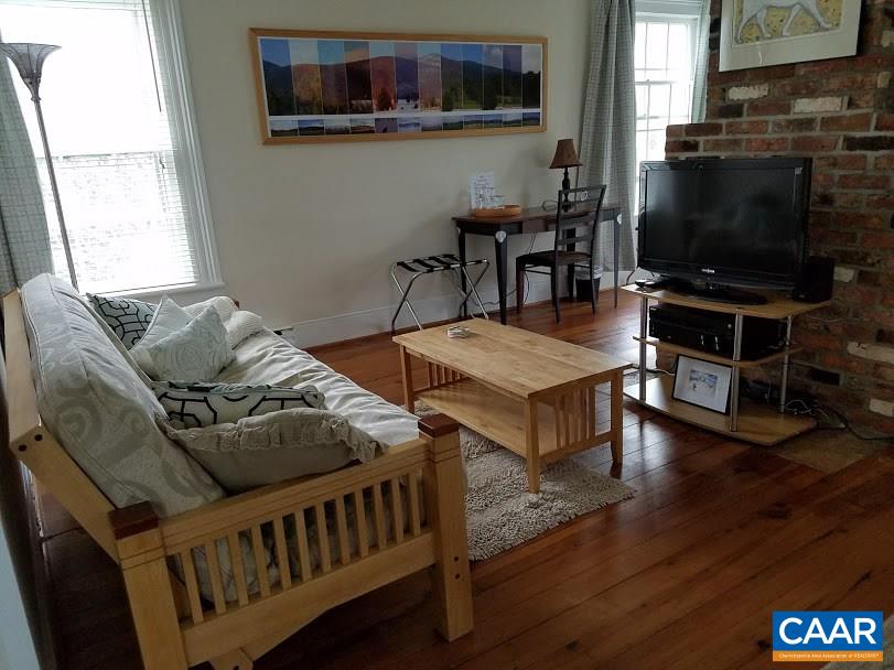27 Chapel Hollow Road Afton, VA 22920 - Photo 19 of 22 a living room with furniture and a flat screen tv