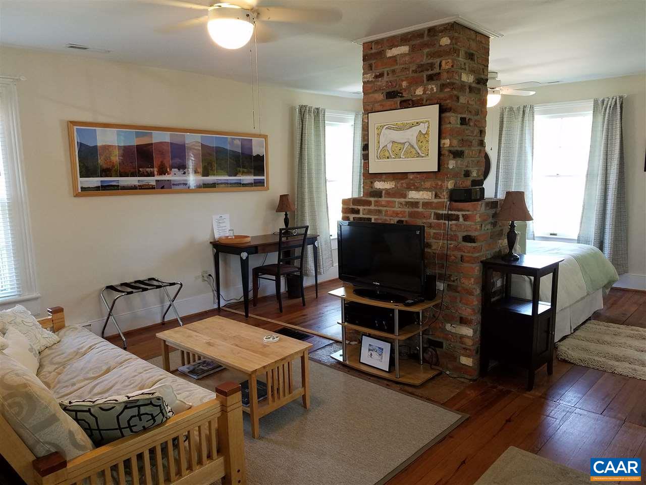27 Chapel Hollow Road Afton, VA 22920 - Photo 2 of 22 a living room with furniture a flat screen tv and kitchen view