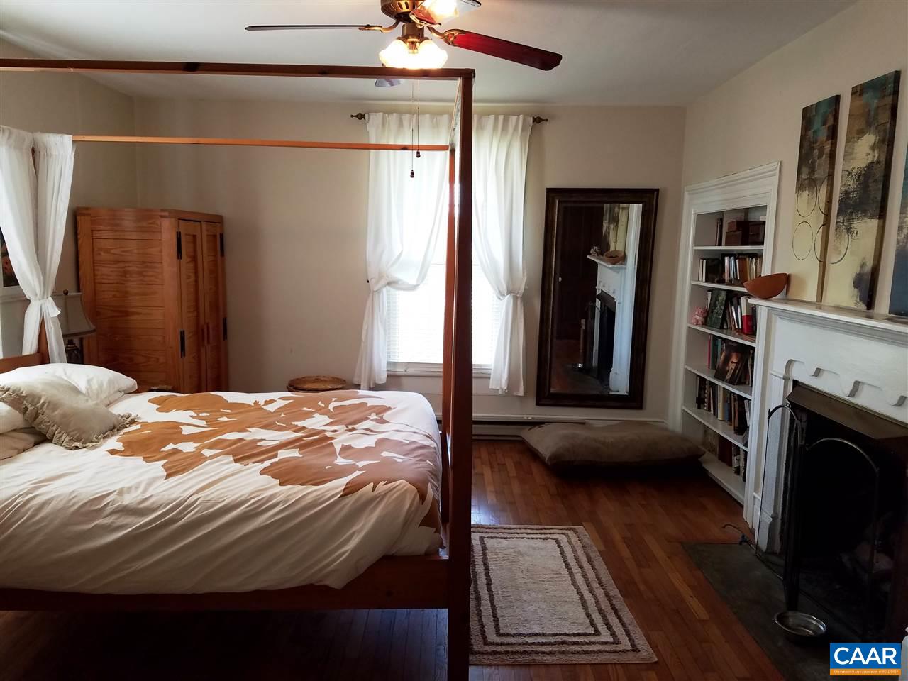 27 Chapel Hollow Road Afton, VA 22920 - Photo 5 of 22 a bedroom with a bed and a flat tv screen