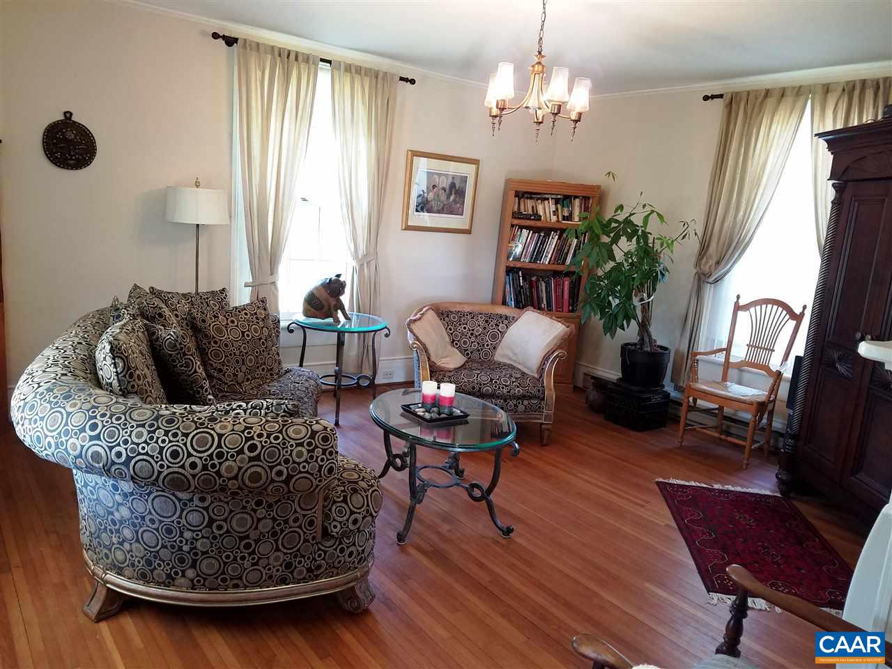 27 Chapel Hollow Road Afton, VA 22920 - Photo 7 of 22 a living room with furniture and a chandelier