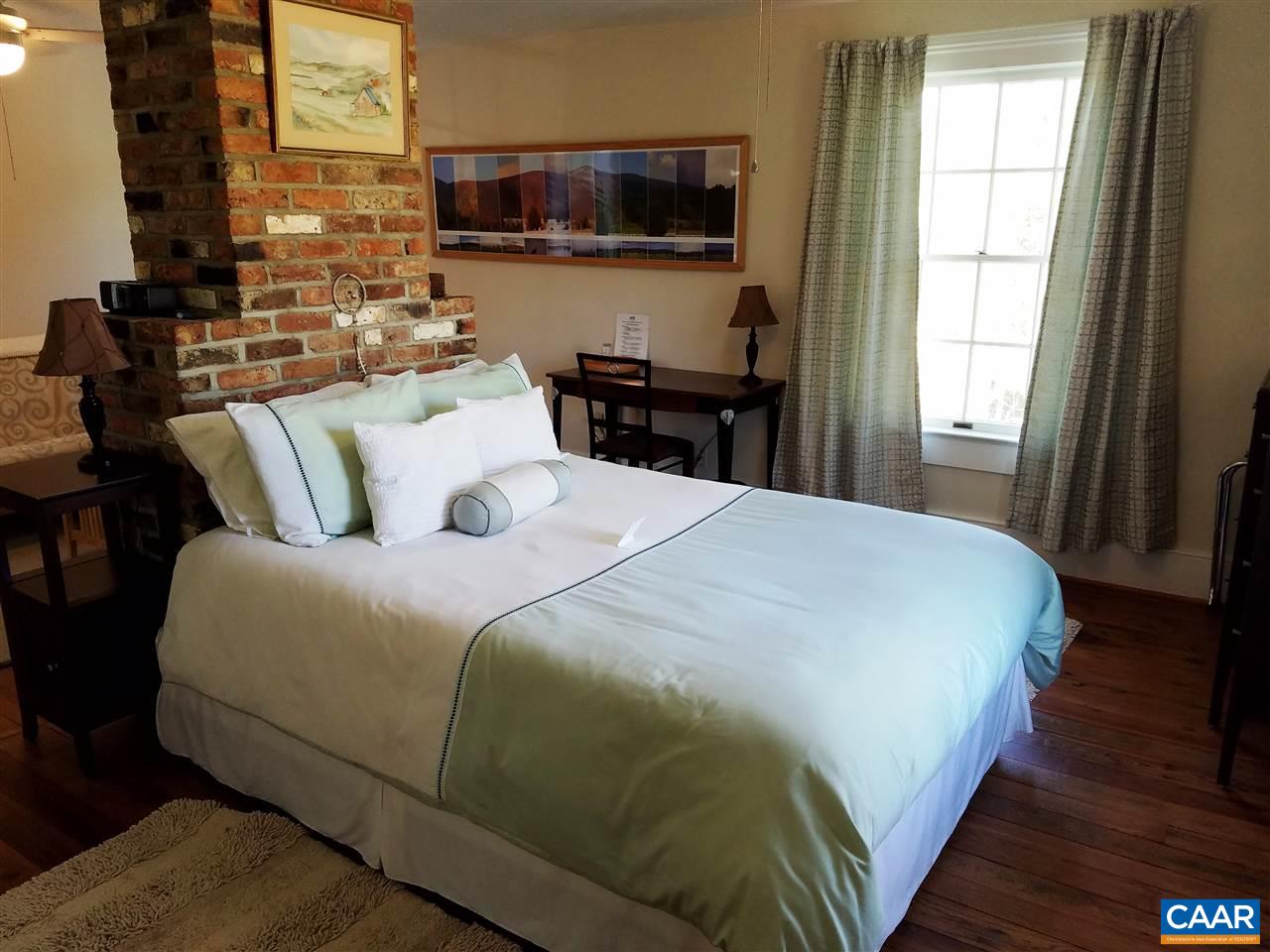 27 Chapel Hollow Road Afton, VA 22920 - Photo 9 of 22 a bedroom with a bed and wooden floor