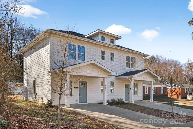 a kitchen with cabinets stainless steel appliances and a sink