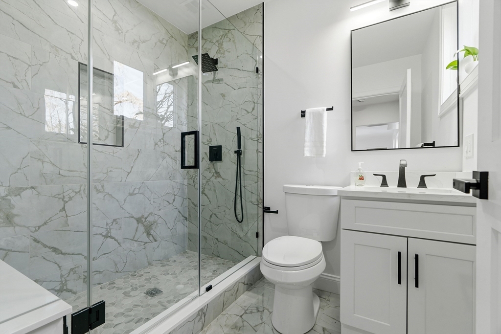 171 Shaw Road Brookline, MA 02467 - Photo 36 of 42 a bathroom with a sink toilet and shower