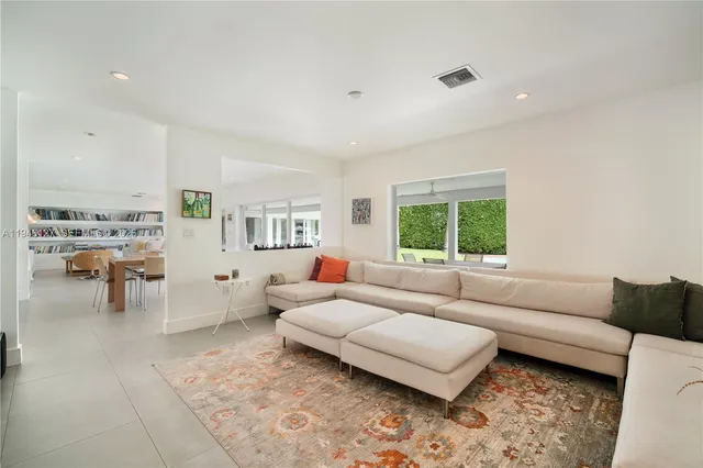 a bedroom with a bed and a table