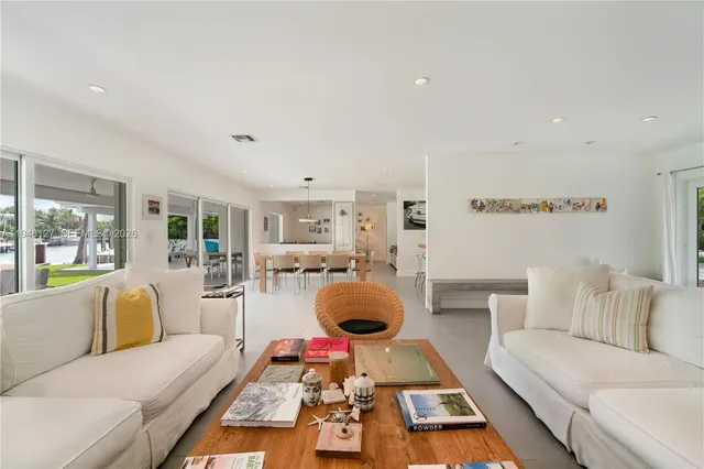 a bathroom with a shower sink vanity mirror and toilet