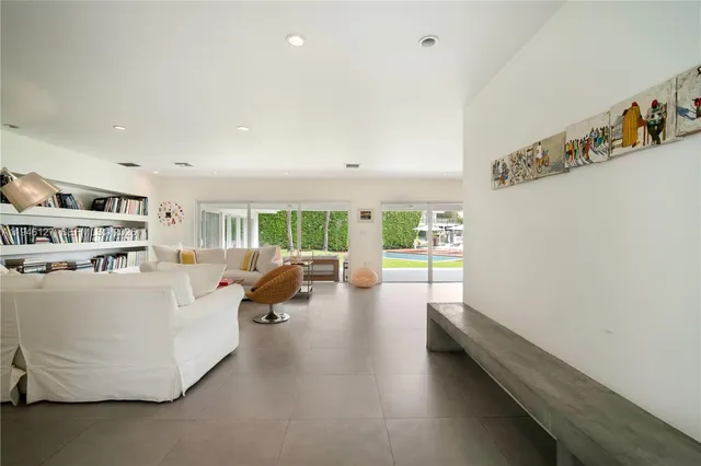 a view of living room with furniture and windows