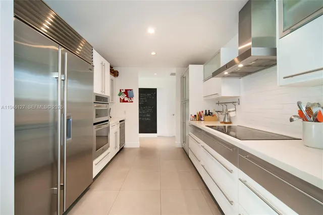 a view of house with swimming pool and yard