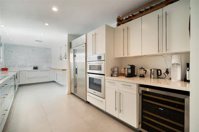 a view of a house with swimming pool and porch
