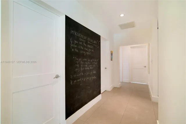 a view of a house with swimming pool and furniture