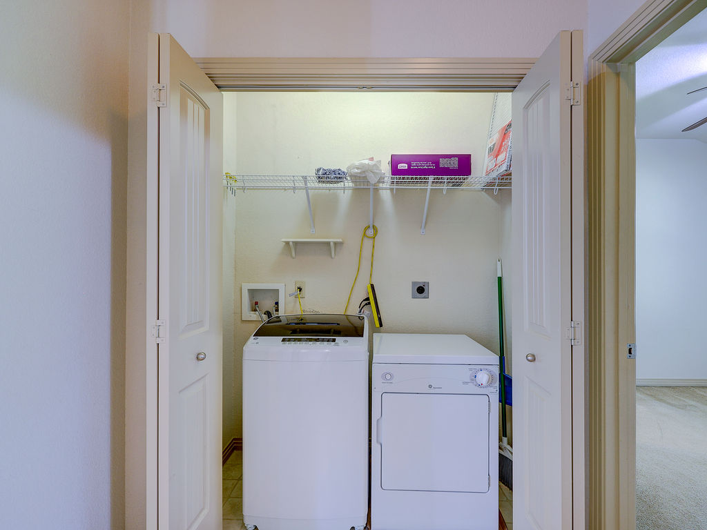 9707 Anderson Mill Road, Unit 22 Austin, TX 78750 - Photo 26 of 39 A dedicated laundry space, conveniently tucked away, streamlines daily chores.