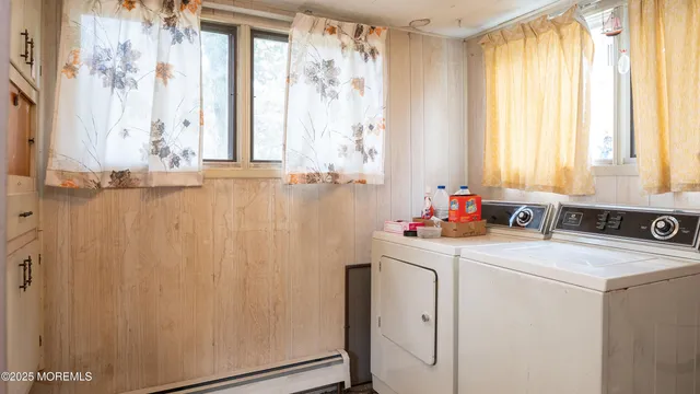 a view of a utility room with windows
