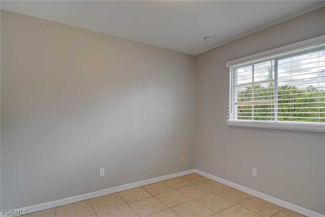 704 Ichabod Avenue Lehigh Acres, FL 33973 - Photo 15 of 22 a view of a room that has a window