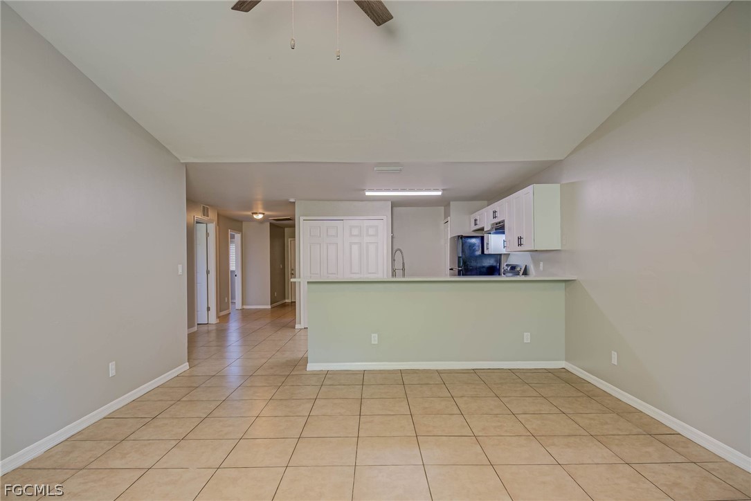 704 Ichabod Avenue Lehigh Acres, FL 33973 - Photo 5 of 22 a view of kitchen and window