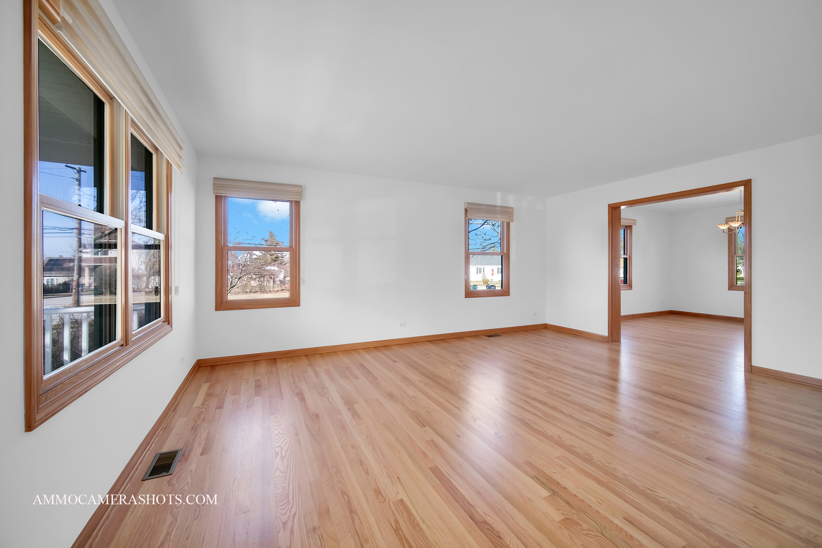 255 West Harrison Road Lombard, IL 60148 - Photo 6 of 36 a view of an empty room with wooden floor and a window