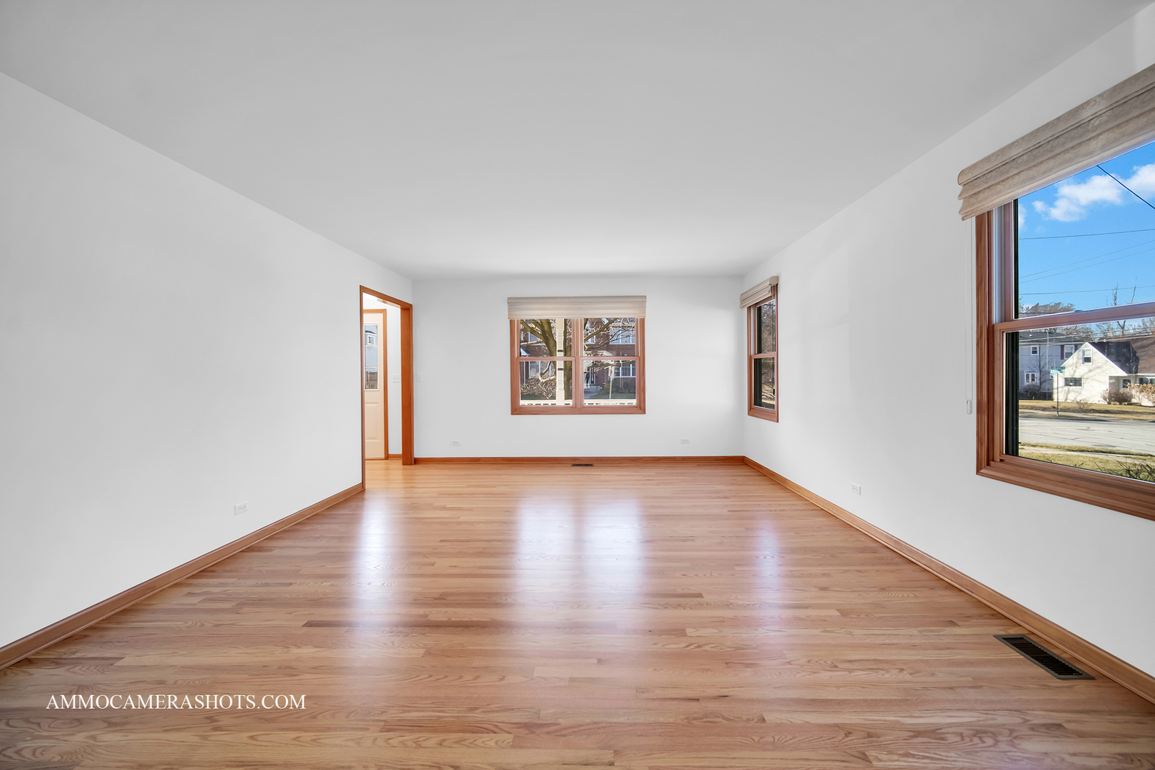 255 West Harrison Road Lombard, IL 60148 - Photo 7 of 36 a view of a big room with wooden floor and windows