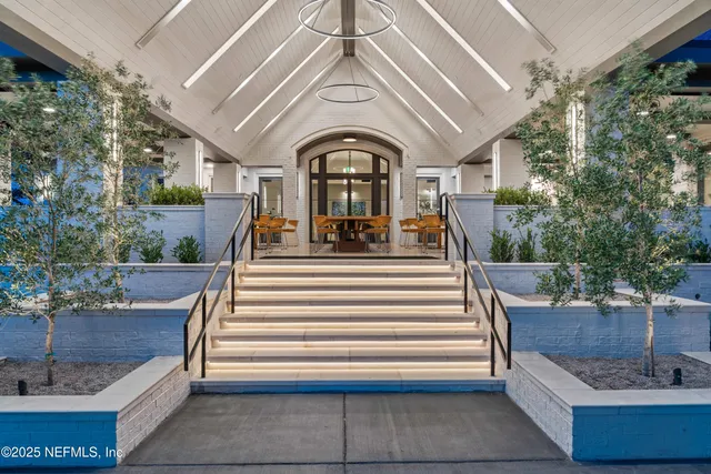 a dining table with chairs and window