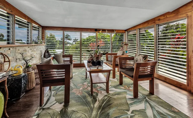 a view of a chairs and table in a patio
