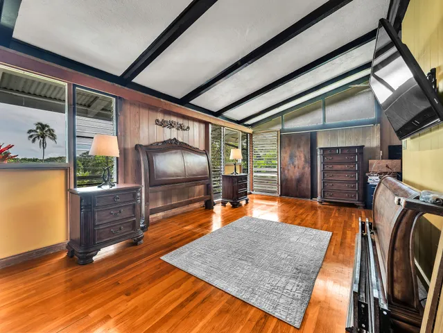 a view of a living room with furniture and a flat screen tv