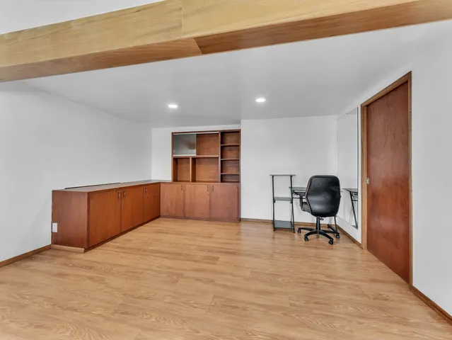 a view of workspace and a window in livingroom
