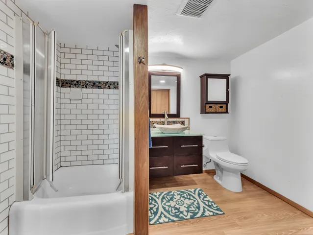 a bathroom with a toilet a sink and bathtub