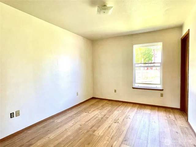 a view of yard with swimming pool and trees