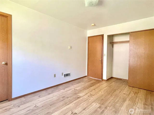 a view of a big yard with swimming pool and green space