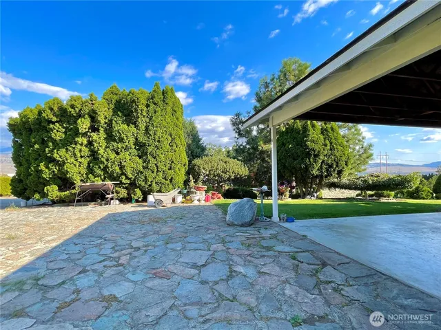 a view of a backyard with porch