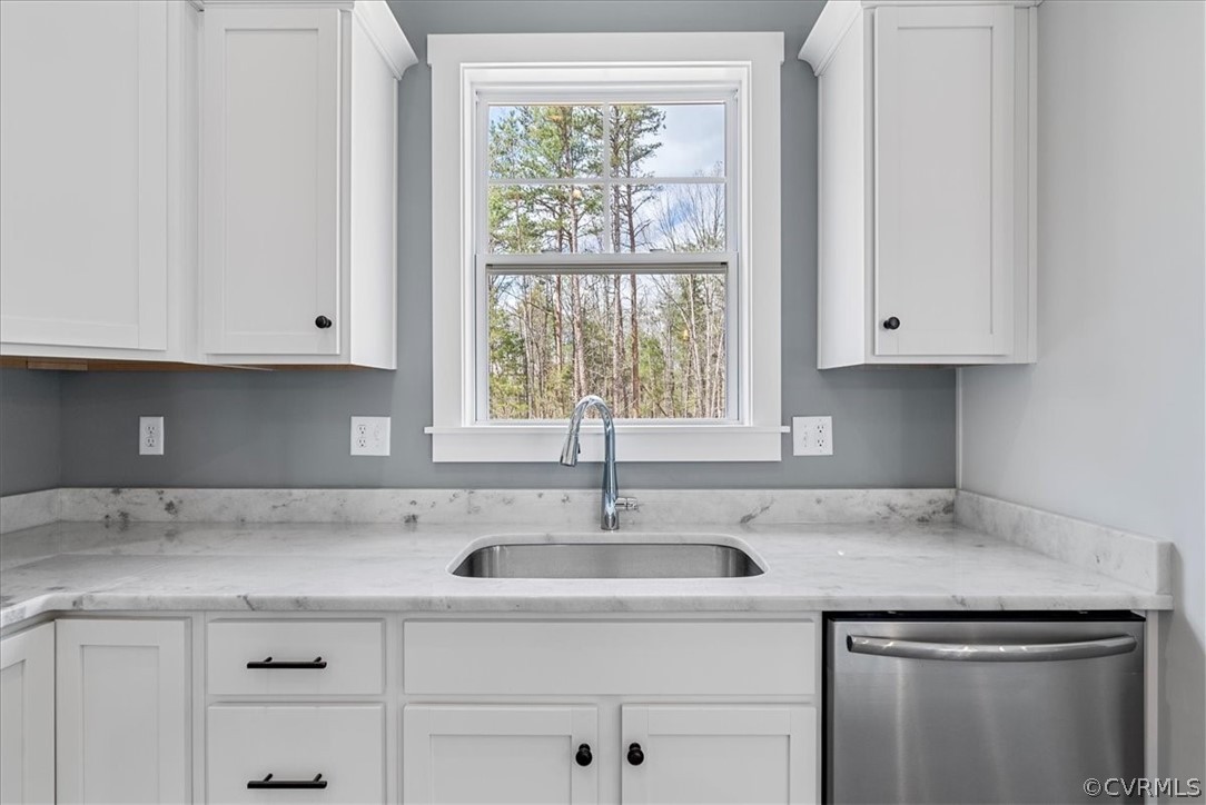 1593 Spreading Oak Road Arvonia, VA 23004 - Photo 18 of 40 a kitchen with stainless steel appliances granite countertop a sink and a white cabinets