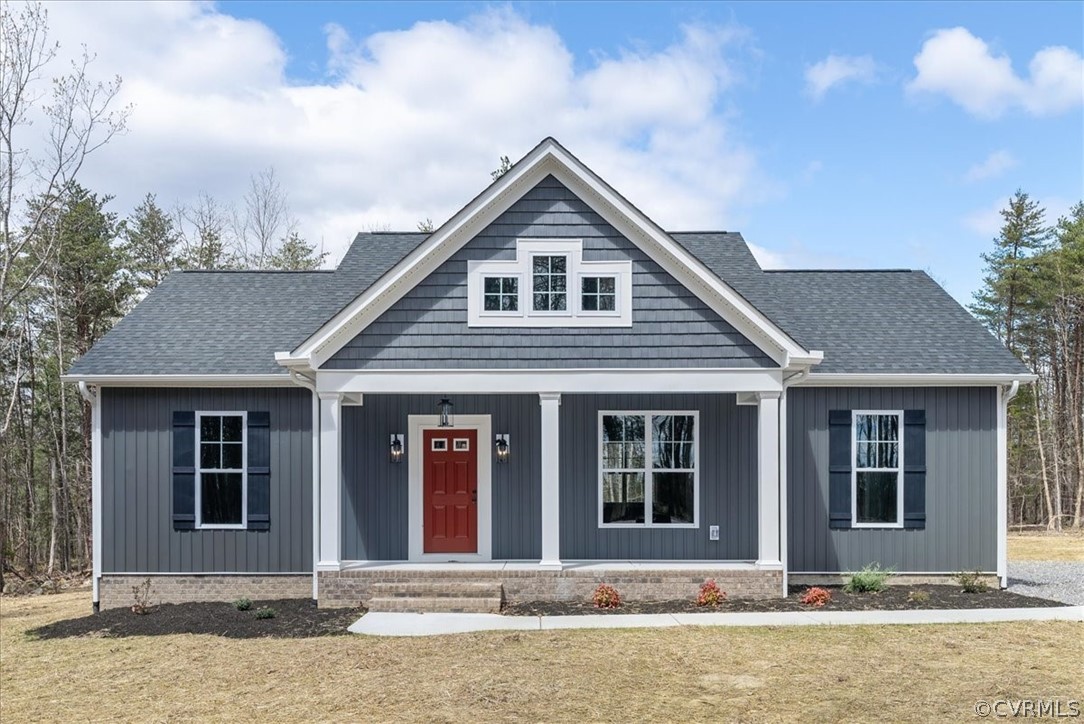 1593 Spreading Oak Road Arvonia, VA 23004 - Photo 4 of 40 a front view of a house with a yard