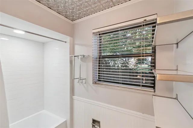 a bathroom with a sink and shower