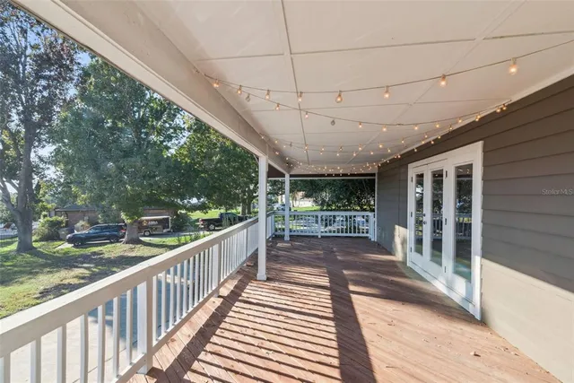 a view of a balcony with wooden floor