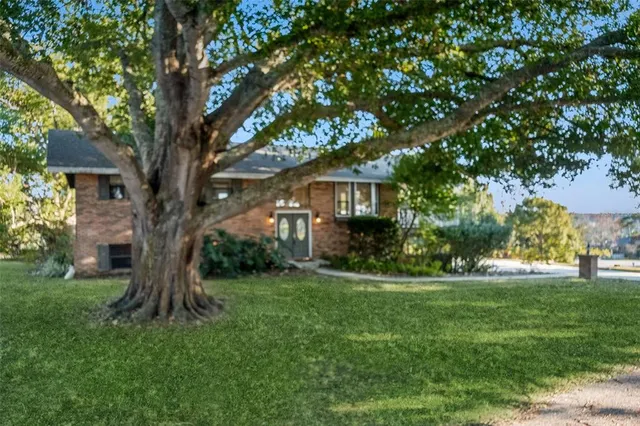 an aerial view of residential building and lake