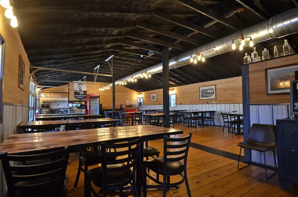 a dining space with furniture and wooden floor