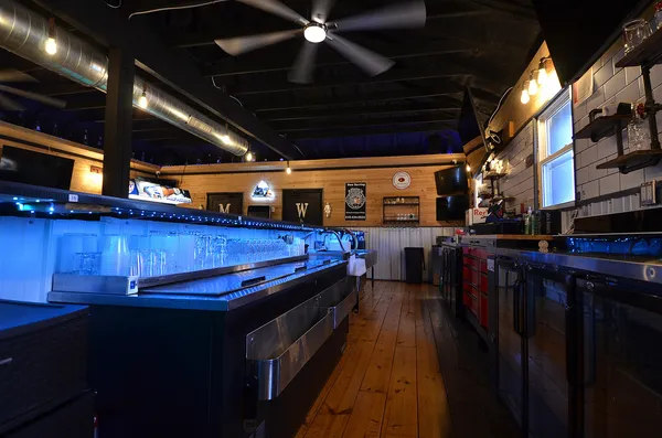 a view of a chairs and table in the room