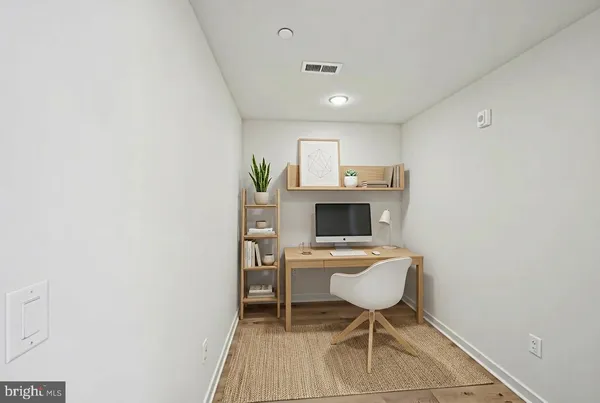 a workspace with furniture and a potted plant