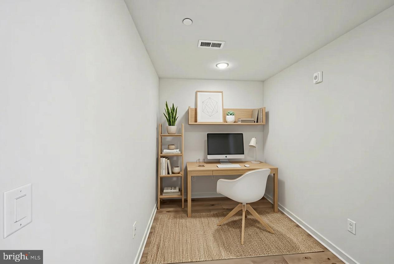 23 Rock Hill Road, Unit 506 Bala Cynwyd, PA 19004 - Photo 3 of 8 a workspace with furniture and a potted plant