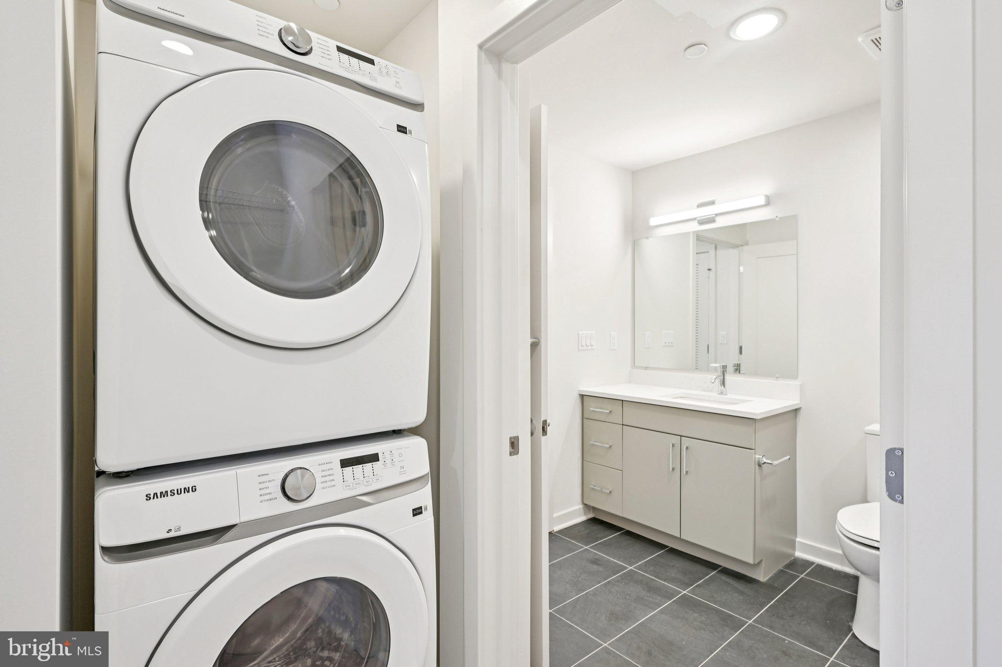 23 Rock Hill Road, Unit 506 Bala Cynwyd, PA 19004 - Photo 6 of 8 a utility room with dryer and washer