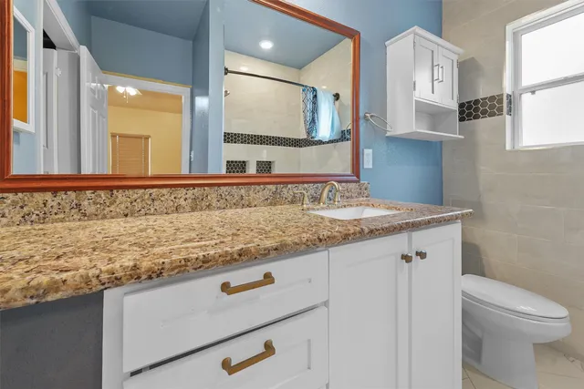 a bathroom with a sink and a toilet