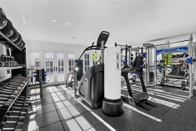 a bathroom with a granite countertop sink a toilet a mirror and shower