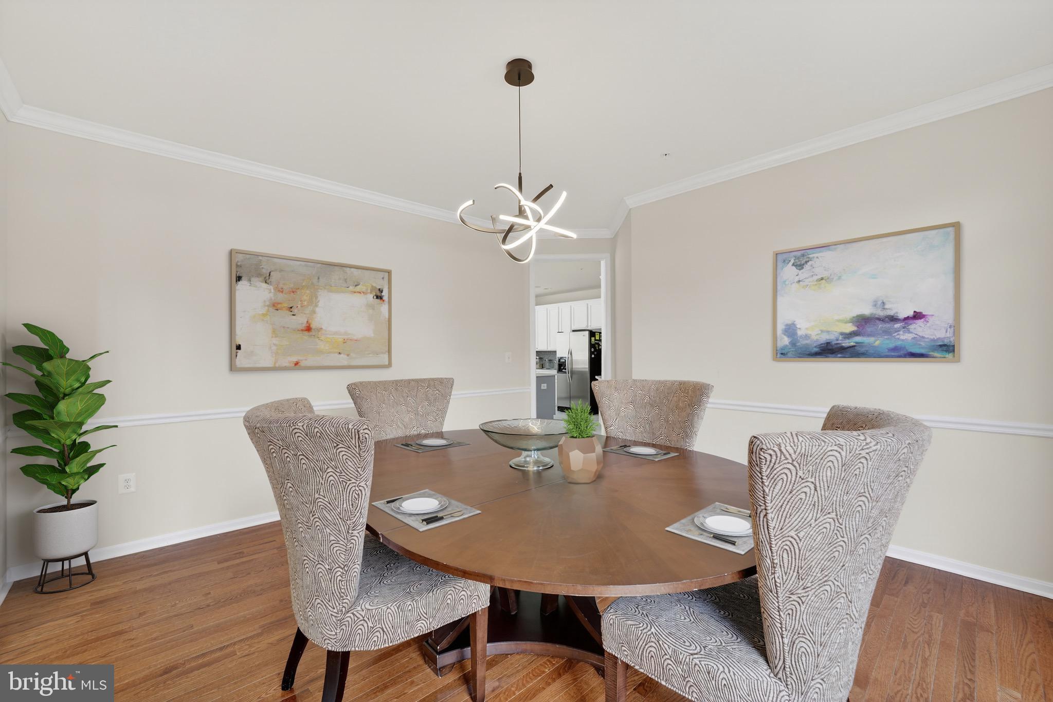 16101 Venice Road Aquasco, MD 20608 - Photo 11 of 61 a view of a dining room with furniture wooden floor and a chandelier