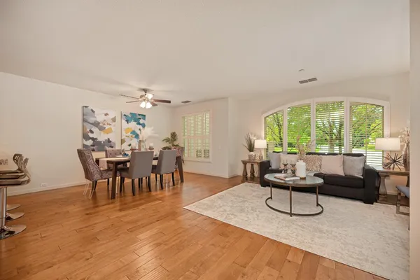a living room with furniture and a large window