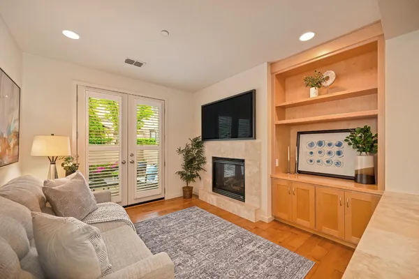 a living room with furniture and a fireplace